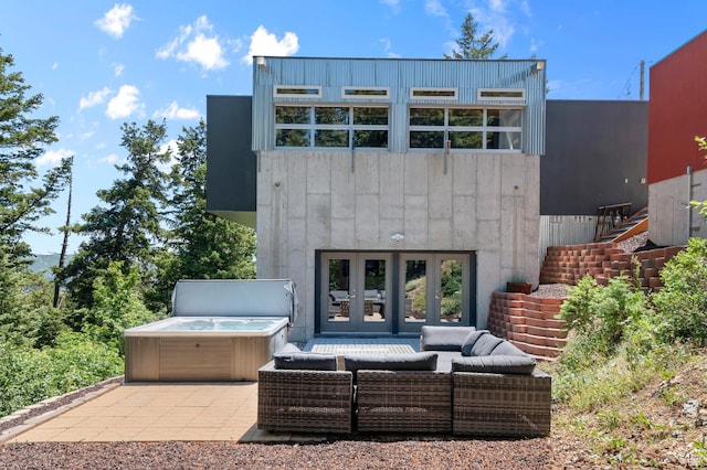 105 S Crestview Cir, Park City, UT 84098 - back of house featuring outdoor lounge area, a hot tub, a garage, a patio area, and stairway