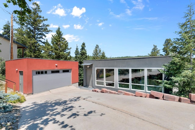 105 S Crestview Cir, Park City, UT 84098 - view of front of home with an outdoor structure, stucco siding, and a detached garage