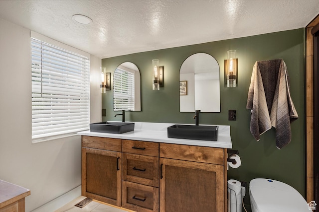 866 Brookside Ln, Centerville, UT 84014 - bathroom featuring double vanity and a textured ceiling