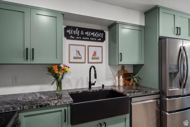 866 Brookside Ln, Centerville, UT 84014 - kitchen with green cabinetry, appliances with stainless steel finishes, and dark stone countertops