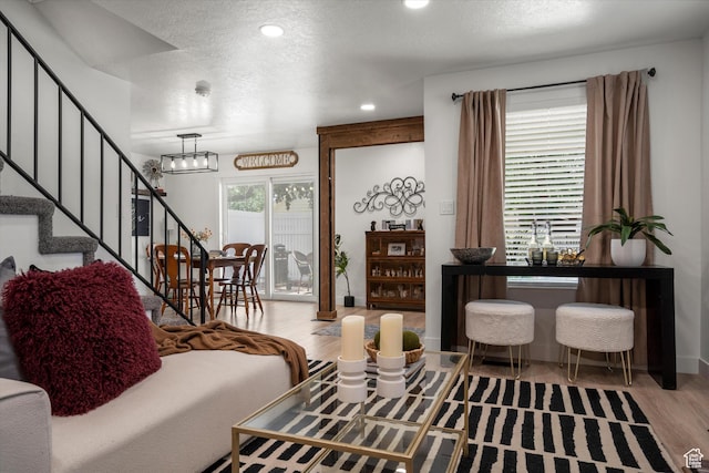 866 Brookside Ln, Centerville, UT 84014 - living room featuring wood finished floors, a textured ceiling, stairway, and recessed lighting