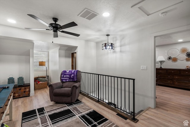 866 Brookside Ln, Centerville, UT 84014 - sitting room featuring wood finished floors, a ceiling fan, attic access, an upstairs landing, and recessed lighting