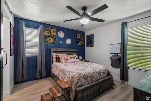 866 Brookside Ln, Centerville, UT 84014 - bedroom with wood finished floors, multiple windows, and ceiling fan