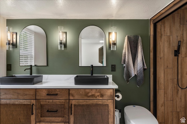 866 Brookside Ln, Centerville, UT 84014 - bathroom with double vanity, a shower, and a textured ceiling