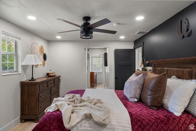 866 Brookside Ln, Centerville, UT 84014 - bedroom with light wood-type flooring, recessed lighting, ceiling fan, and a textured ceiling
