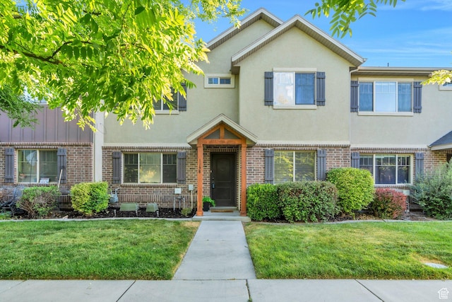 1158 W 150 S, Springville, UT 84663 - townhome / multi-family property with brick siding, a front yard, and stucco siding