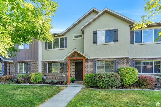 1158 W 150 S, Springville, UT 84663 - view of property featuring brick siding, a front yard, and stucco siding