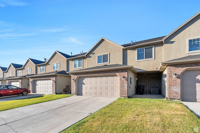 1158 W 150 S, Springville, UT 84663 - multi unit property featuring a front lawn, stucco siding, a garage, and driveway