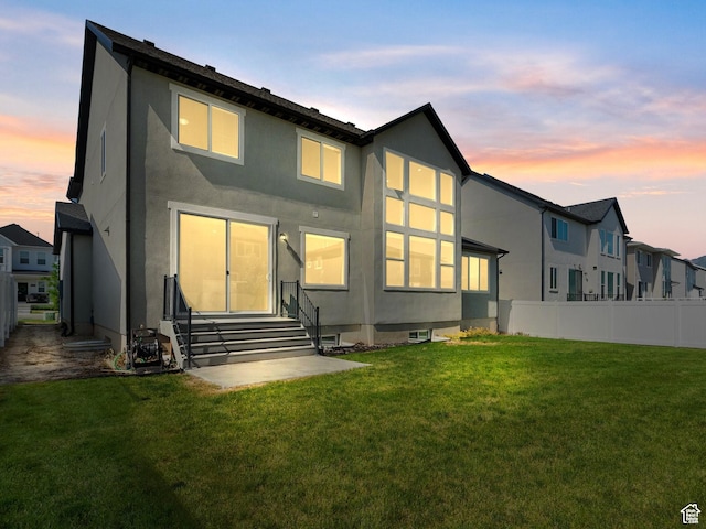 1583 W Andover Rd, South Jordan, UT 84095 - back of property at dusk with entry steps and stucco siding