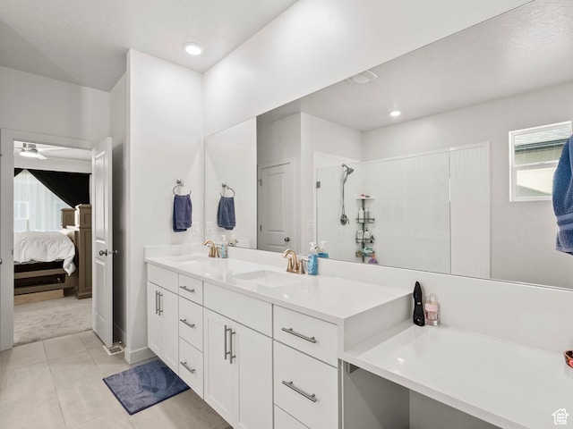 1583 W Andover Rd, South Jordan, UT 84095 - full bath featuring connected bathroom, double vanity, ceiling fan, tile patterned floors, and a shower