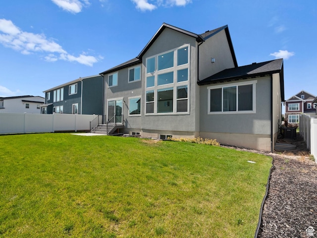 1583 W Andover Rd, South Jordan, UT 84095 - rear view of house featuring a fenced backyard and stucco siding
