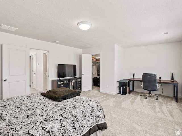 1583 W Andover Rd, South Jordan, UT 84095 - bedroom featuring light colored carpet, a textured ceiling, a spacious closet, and a desk