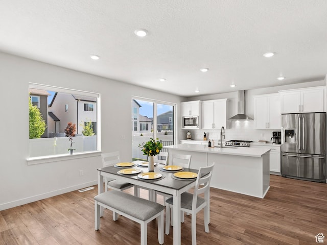 1583 W Andover Rd, South Jordan, UT 84095 - dining area with wood finished floors and recessed lighting