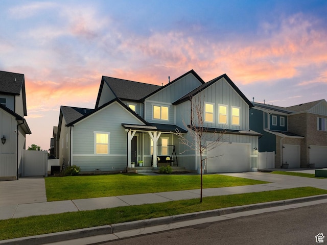 1583 W Andover Rd, South Jordan, UT 84095 - view of front of property featuring board and batten siding, concrete driveway, and an attached garage