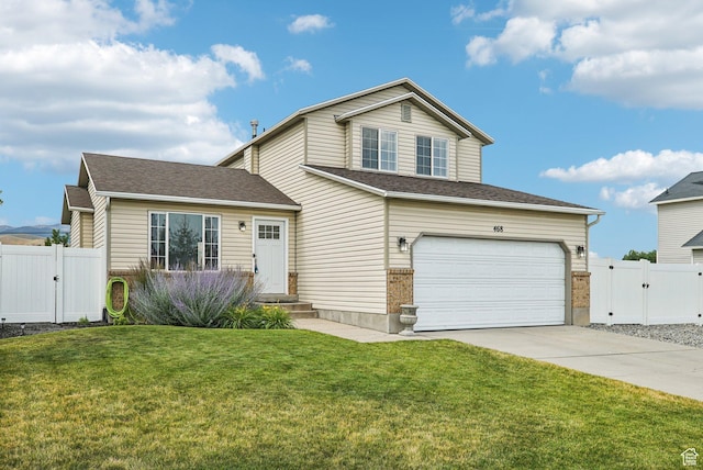 468 E Lindy Way N, Tooele, UT 84074 - view of front facade featuring a gate, concrete driveway, and an attached garage