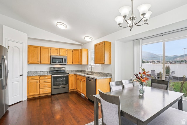 468 E Lindy Way N, Tooele, UT 84074 - kitchen featuring appliances with stainless steel finishes, vaulted ceiling, a chandelier, dark wood-style flooring, and hanging light fixtures