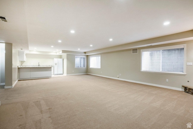 999 S Fairway Cir, Fruit Heights, UT 84037 - unfurnished living room with light carpet and recessed lighting