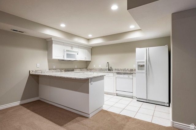 999 S Fairway Cir, Fruit Heights, UT 84037 - kitchen with white appliances, a peninsula, light carpet, light stone countertops, and recessed lighting