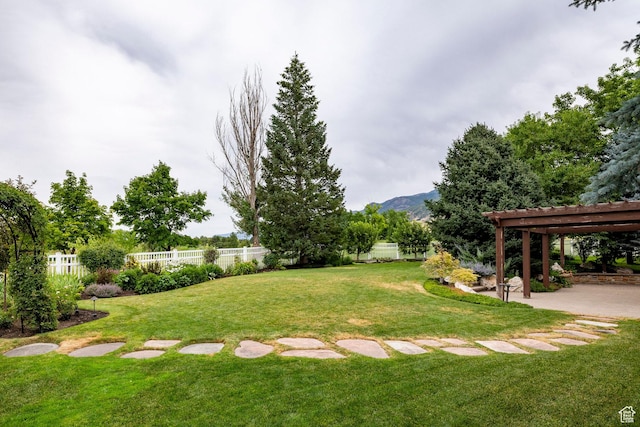 999 S Fairway Cir, Fruit Heights, UT 84037 - fenced backyard with a pergola, a patio area, and a mountain view