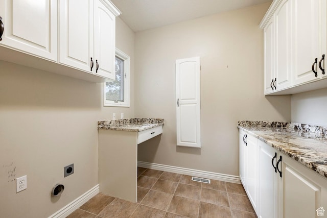 999 S Fairway Cir, Fruit Heights, UT 84037 - laundry area with cabinet space, hookup for an electric dryer, and light tile patterned floors