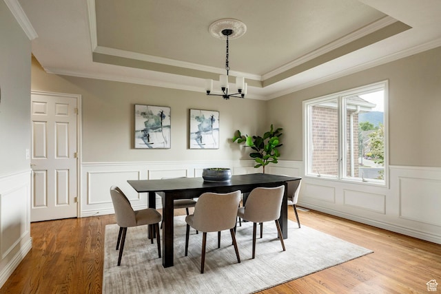 999 S Fairway Cir, Fruit Heights, UT 84037 - dining area with a raised ceiling, a chandelier, ornamental molding, light wood finished floors, and wainscoting