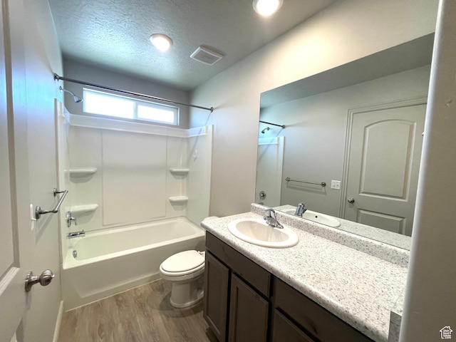 228 W 2370 N, Tooele, UT 84074 - bathroom with wood finished floors, tub / shower combination, vanity, and a textured ceiling