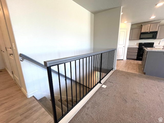 228 W 2370 N, Tooele, UT 84074 - hall featuring an upstairs landing, light wood finished floors, and recessed lighting