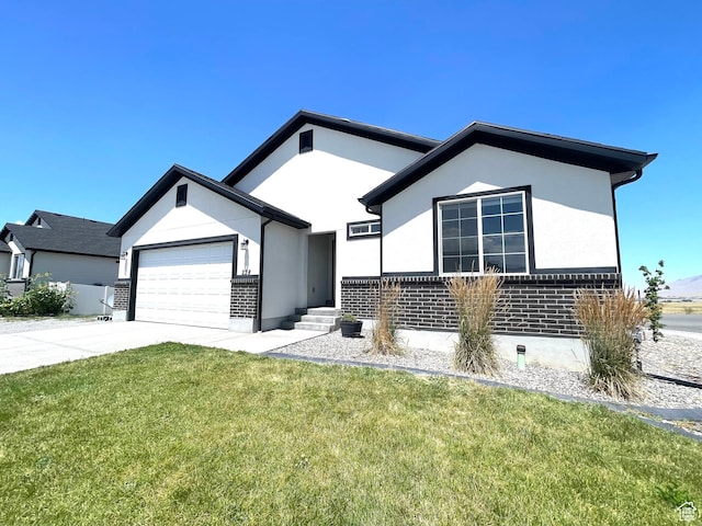 228 W 2370 N, Tooele, UT 84074 - ranch-style home with a garage, a front lawn, stucco siding, and driveway