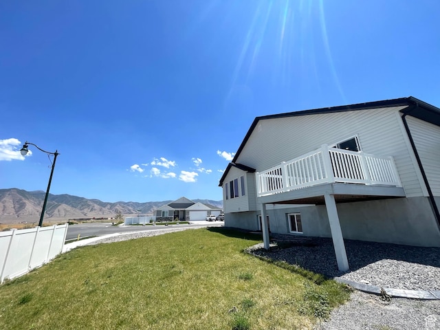 228 W 2370 N, Tooele, UT 84074 - view of side of home with a deck with mountain view