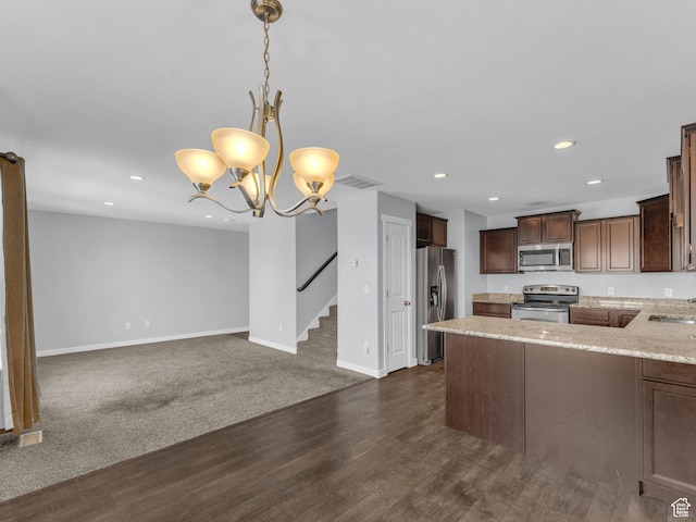 81 E E Side Hill Ln S, Draper, UT 84020 - kitchen with appliances with stainless steel finishes, recessed lighting, dark wood-style floors, decorative light fixtures, and dark brown cabinets