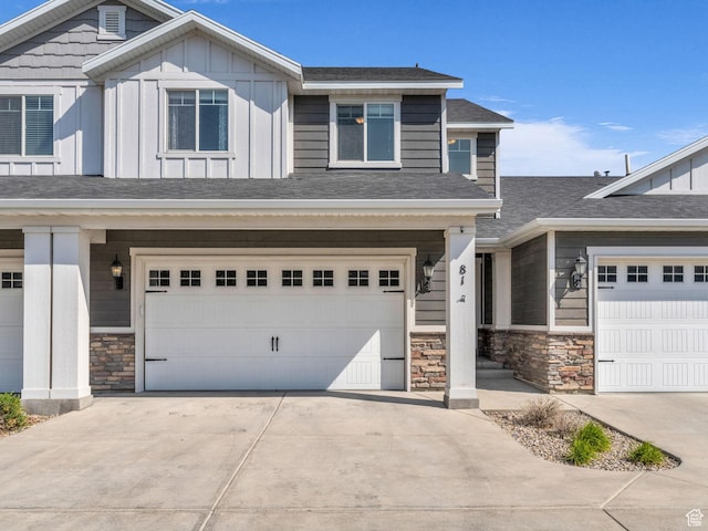 81 E E Side Hill Ln S, Draper, UT 84020 - craftsman-style house featuring stone siding, board and batten siding, a garage, and driveway