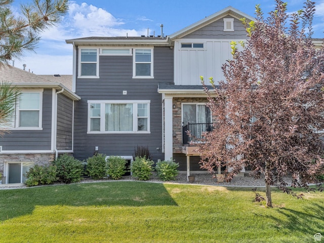 81 E E Side Hill Ln S, Draper, UT 84020 - view of front of property featuring board and batten siding, a front yard, and stone siding