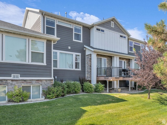 81 E E Side Hill Ln S, Draper, UT 84020 - rear view of property with stone siding, board and batten siding, and a yard