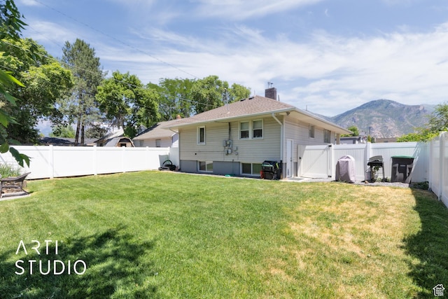 45 N 900 W, Provo, UT 84601 - back of house featuring a fenced backyard, a chimney, a gate, and a mountain view