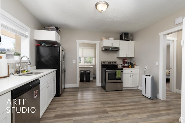 45 N 900 W, Provo, UT 84601 - kitchen with stainless steel appliances, under cabinet range hood, and white cabinets