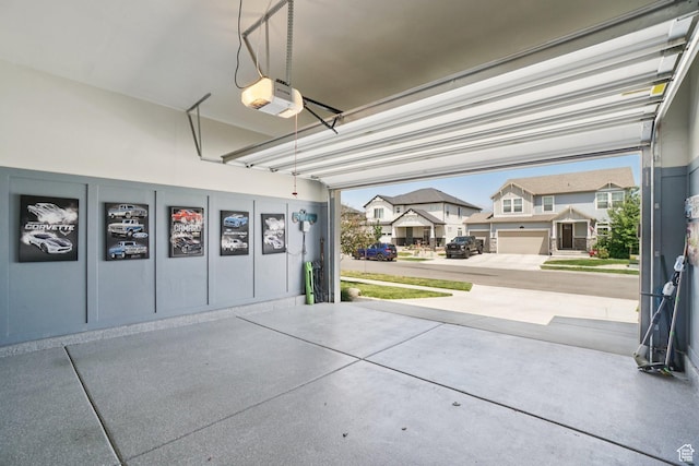 287 S Hayes Well Ln, Saratoga Springs, UT 84045 - garage featuring a garage door opener and a residential view