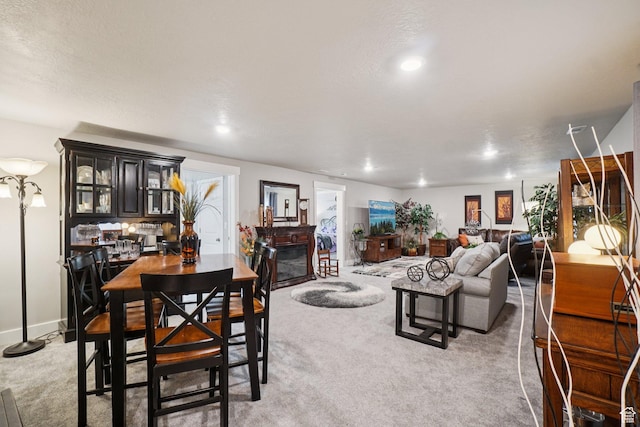 287 S Hayes Well Ln, Saratoga Springs, UT 84045 - living area with a glass covered fireplace, carpet, and recessed lighting
