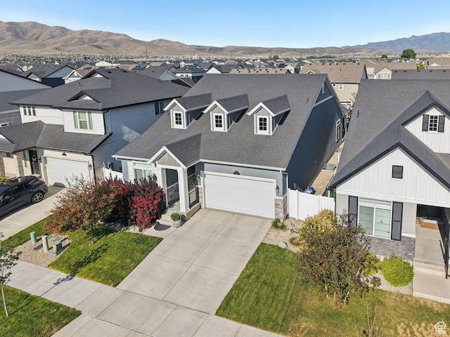 287 S Hayes Well Ln, Saratoga Springs, UT 84045 - view of front of property featuring a residential view, stone siding, an attached garage, and board and batten siding