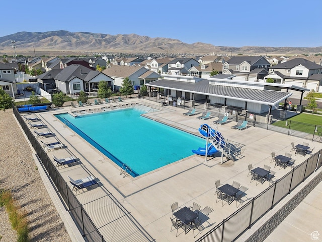 287 S Hayes Well Ln, Saratoga Springs, UT 84045 - community pool featuring a residential view, a mountain view, and a patio