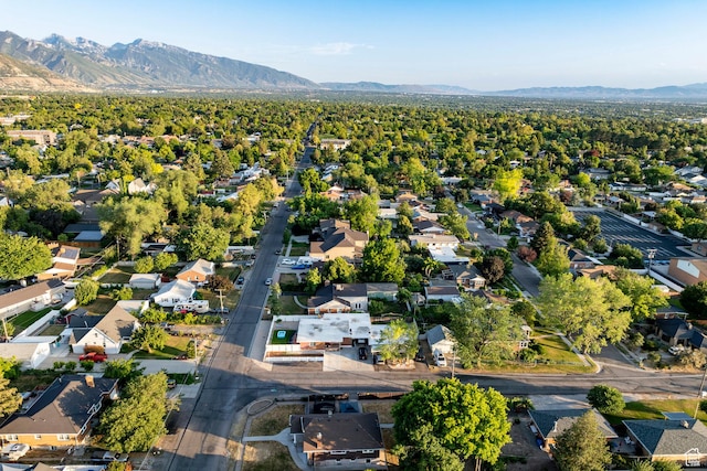 3076 S Melbourne St, Millcreek, UT 84106 - aerial perspective of suburban area with a mountain backdrop