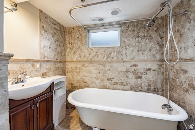 3076 S Melbourne St, Millcreek, UT 84106 - bathroom featuring vanity, a freestanding bath, tile walls, a shower, and tile patterned flooring