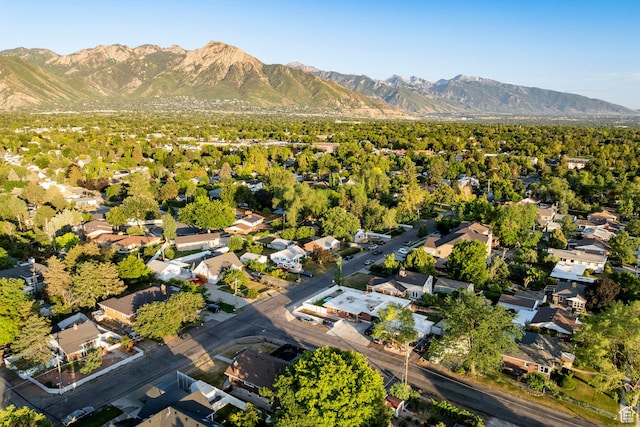 3076 S Melbourne St, Millcreek, UT 84106 - aerial view of property and surrounding area featuring a mountainous background and nearby suburban area