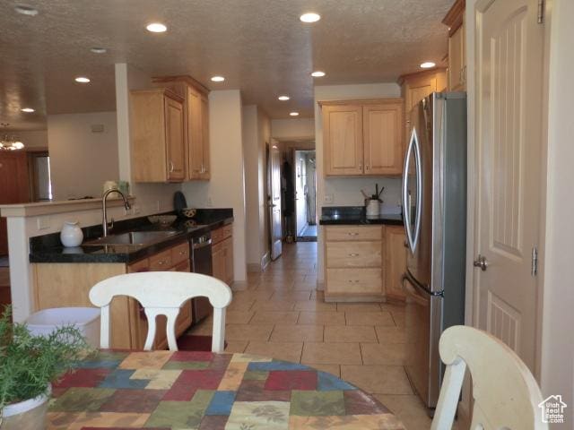 320 S 1125 W, Parowan, UT 84761 - kitchen featuring appliances with stainless steel finishes, light brown cabinetry, recessed lighting, light tile patterned floors, and a peninsula