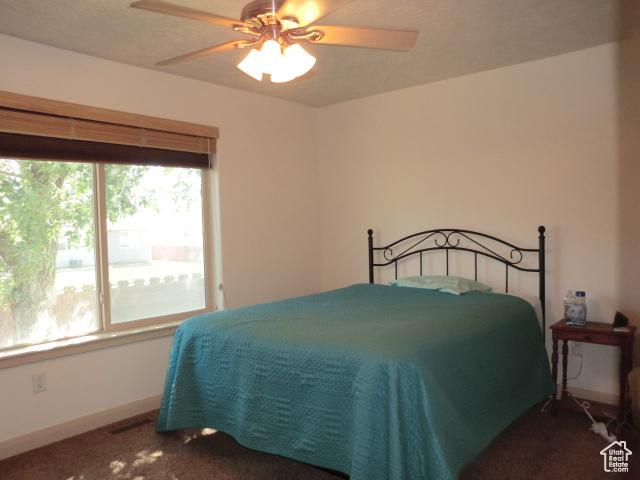 320 S 1125 W, Parowan, UT 84761 - bedroom featuring a ceiling fan and carpet