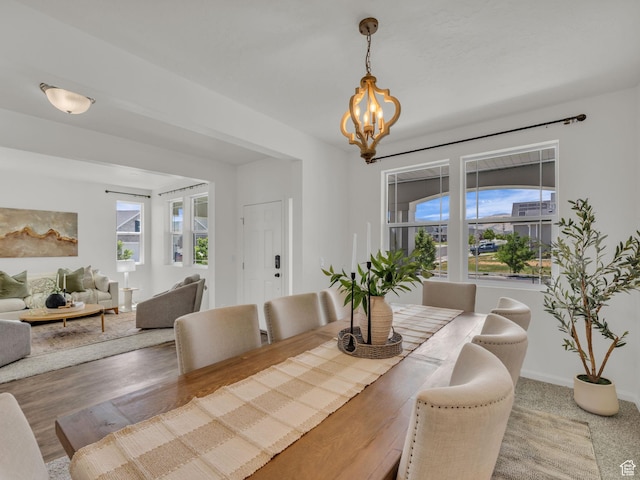 13249 S Shearing Cv, Herriman, UT 84096 - dining room with a chandelier and baseboards