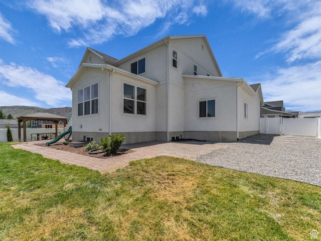 13249 S Shearing Cv, Herriman, UT 84096 - rear view of house featuring stucco siding and a patio area
