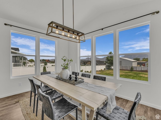 13249 S Shearing Cv, Herriman, UT 84096 - dining space with a chandelier and wood finished floors