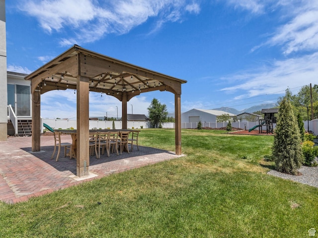 13249 S Shearing Cv, Herriman, UT 84096 - view of yard featuring a gazebo, a patio area, and a playground