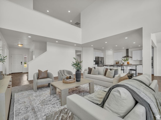 13249 S Shearing Cv, Herriman, UT 84096 - living area with light wood finished floors, recessed lighting, and a high ceiling