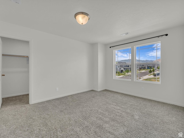 13249 S Shearing Cv, Herriman, UT 84096 - unfurnished bedroom with carpet, a spacious closet, and a closet